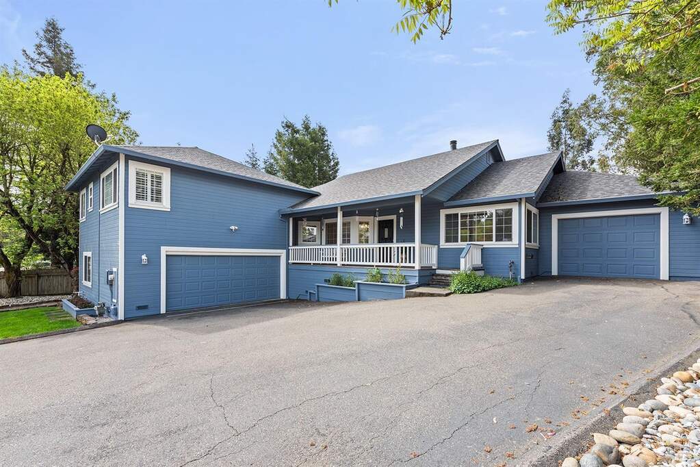 Custom built home first time on market, featuring a covered front porch, a 2 car garage (~19 feet 9 inches* wide by ~24 feet 5 inches* deep) on the left, and 1 car L shaped garage (see dimensions with picture) with extra space. Owned solar and an open pas at 4 Issel Court, Cotati, CA 94931